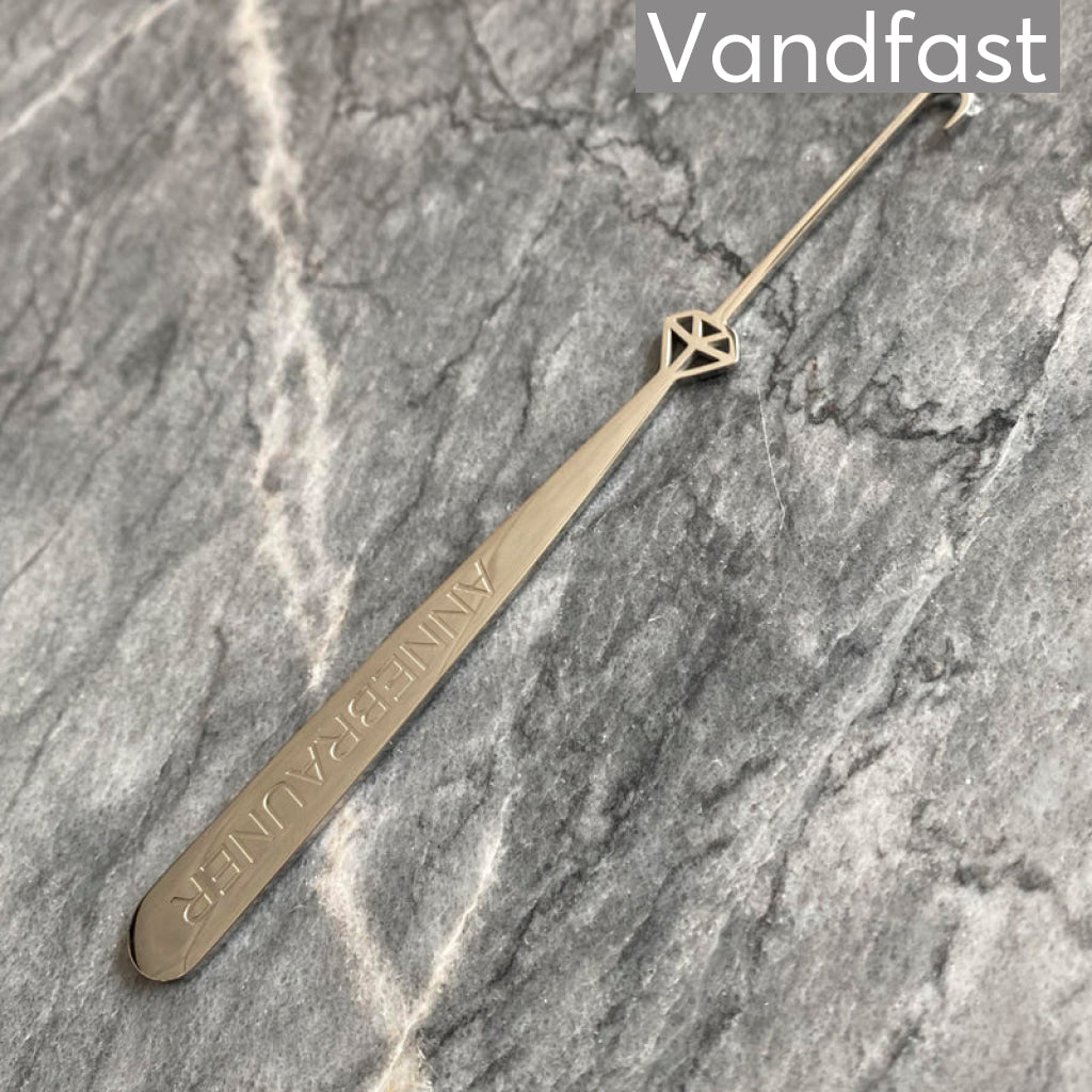 Annebrauner Armbåndshjælper